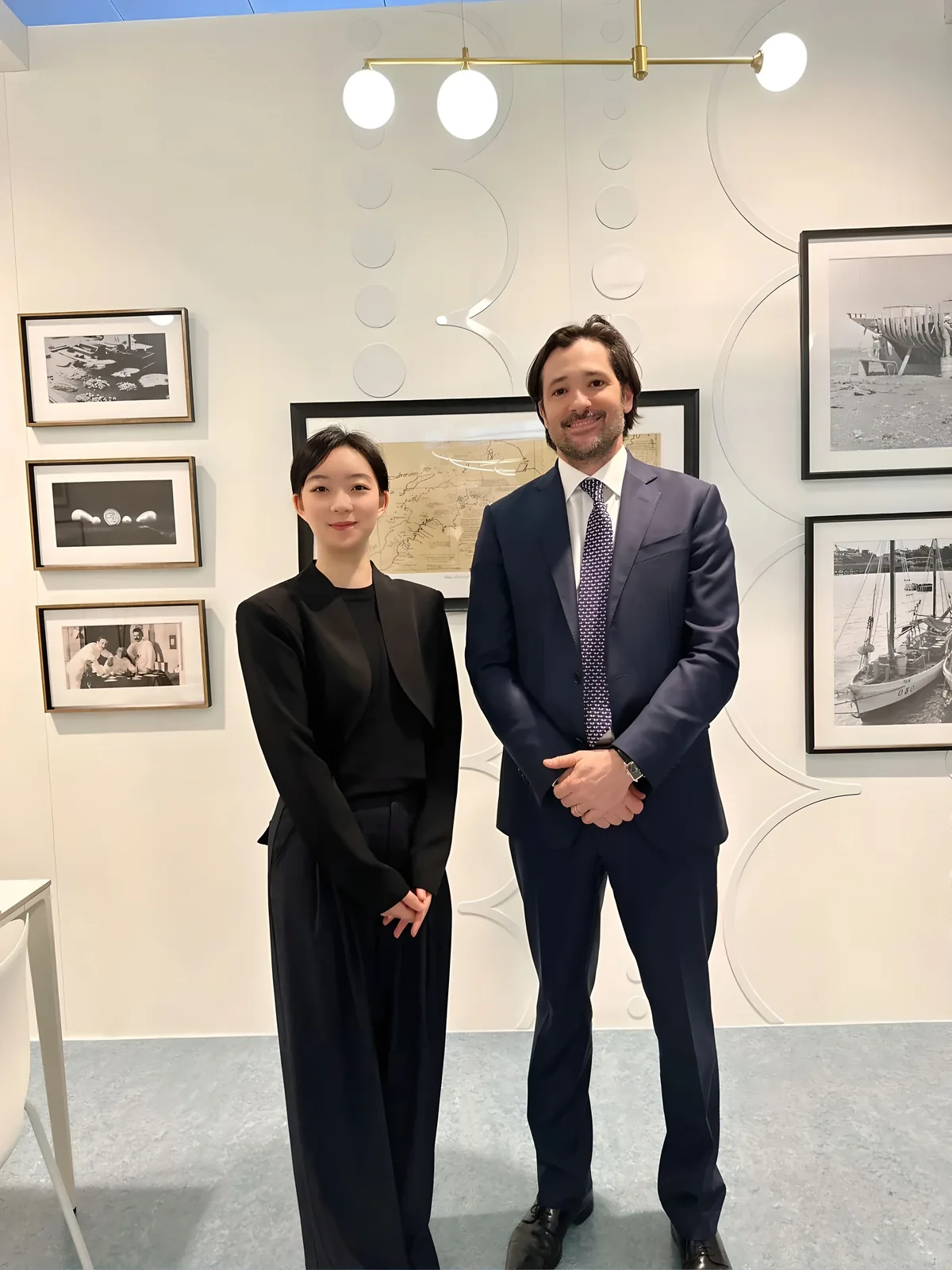 Two people standing together in a jewelry showroom