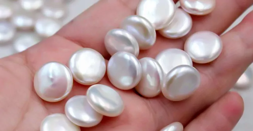 Flattened white pearls with rounded faces