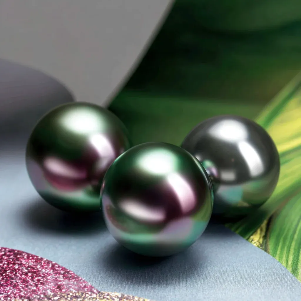 Illustration of dark pearls with green and purple reflections