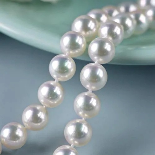 White Akoya pearl strands with soft pink and silver overtones