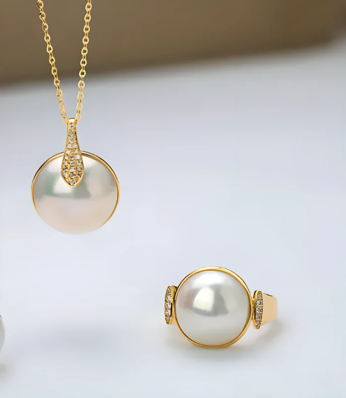 Abalone-related Mabé material can show stronger iridescence than typical white pearl-oyster Mabé pearls.