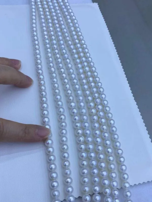 clean close-up photo of white or pastel freshwater pearl strands.