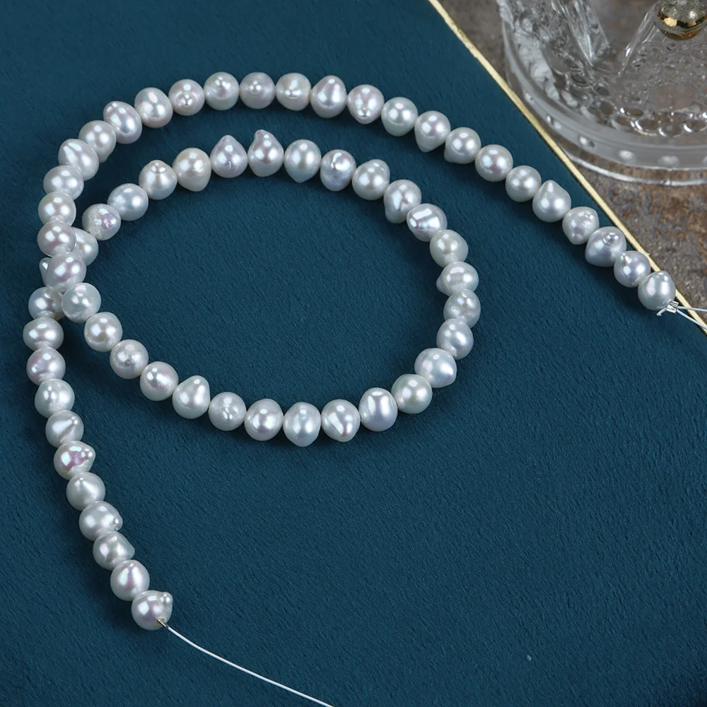 Cool-Toned Lightly Blemished Drop-Shaped Freshwater Baroque Pearl Strand