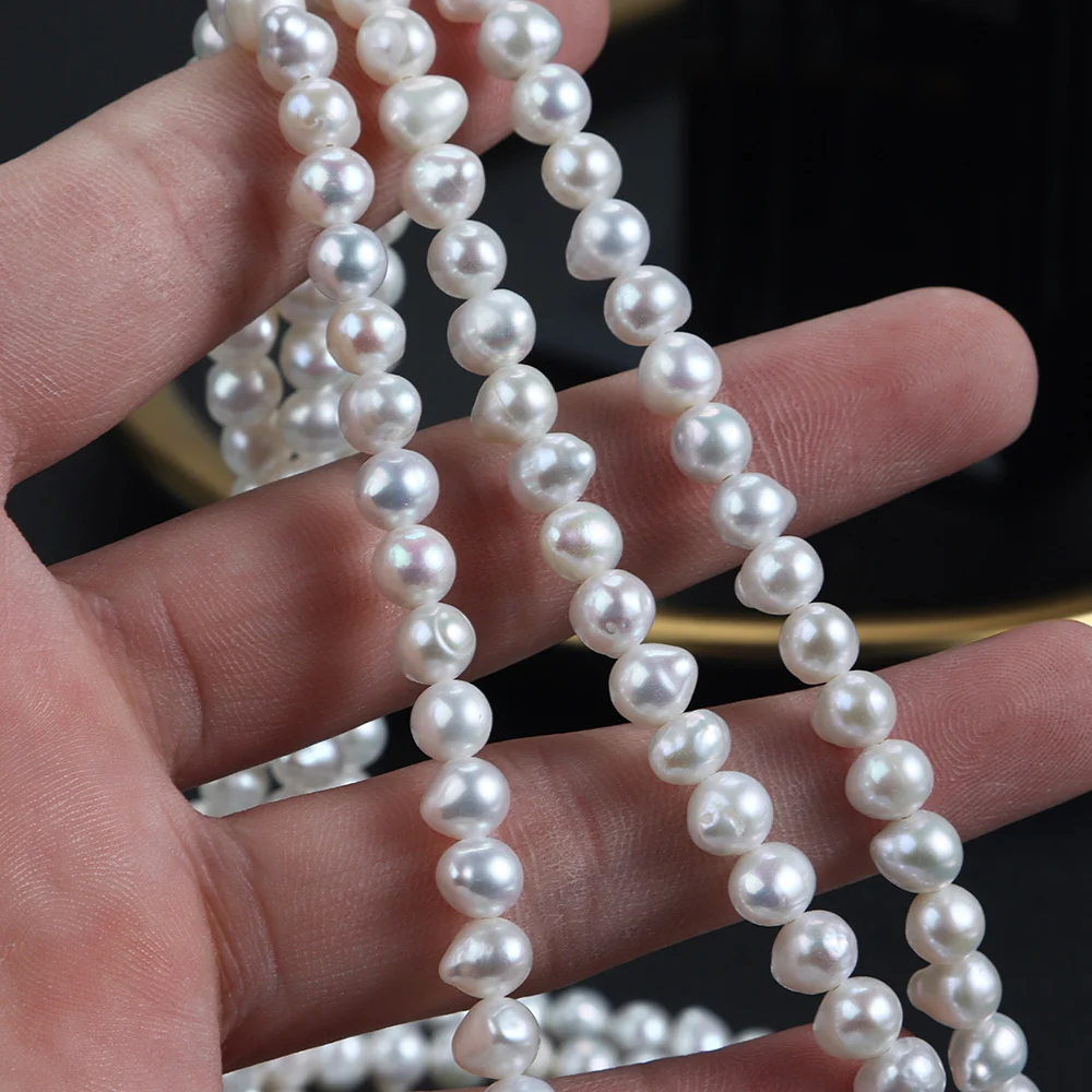 Cool-Toned Lightly Blemished Drop-Shaped Freshwater Baroque Pearl Strand