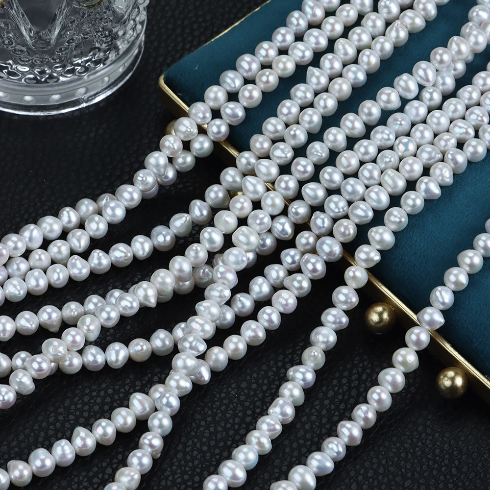 Cool-Toned Lightly Blemished Drop-Shaped Freshwater Baroque Pearl Strand