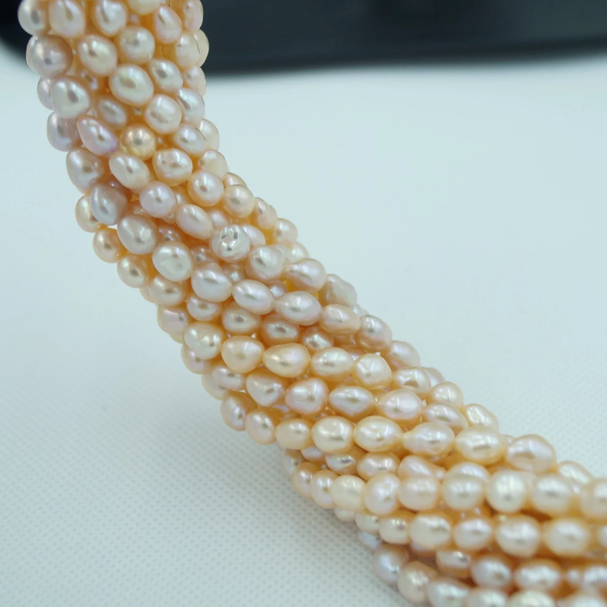 Iridescent White Lightly Blemished Two-Side Luster Freshwater Pearl Strand