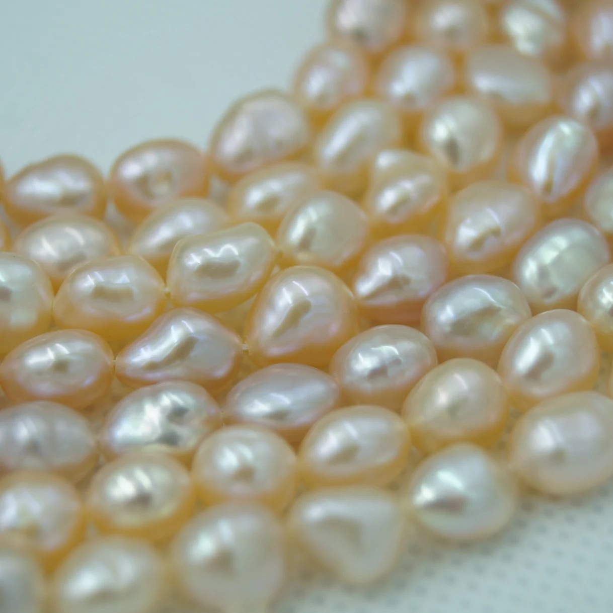 Iridescent White Lightly Blemished Two-Side Luster Freshwater Pearl Strand