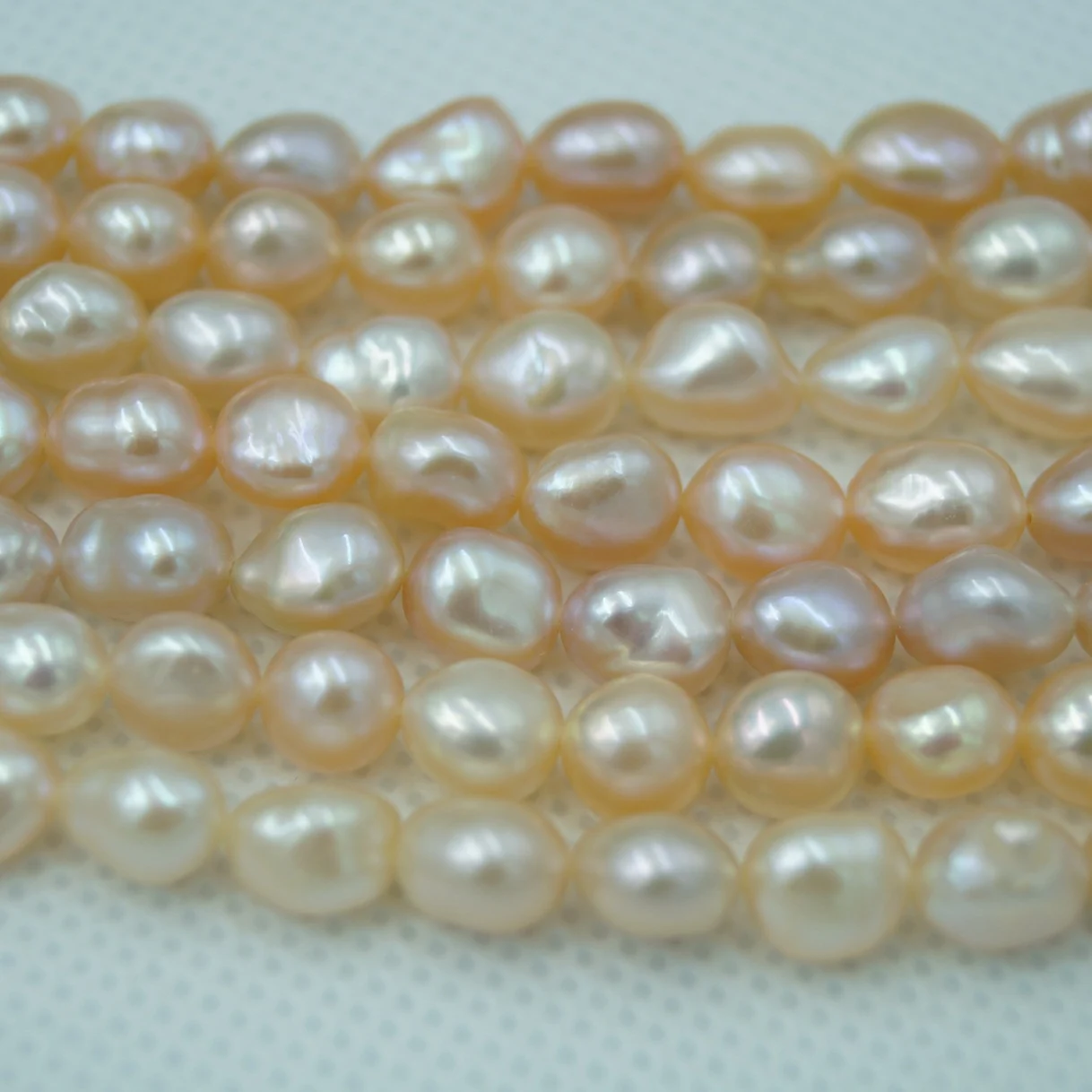 Iridescent White Lightly Blemished Two-Side Luster Freshwater Pearl Strand