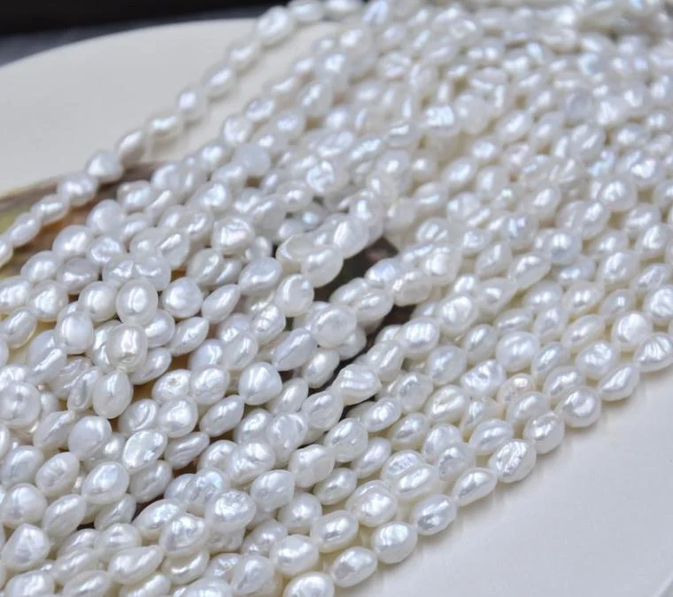 Cream White Lightly Blemished Organic Freshwater Keshi Baroque Pearl Strand