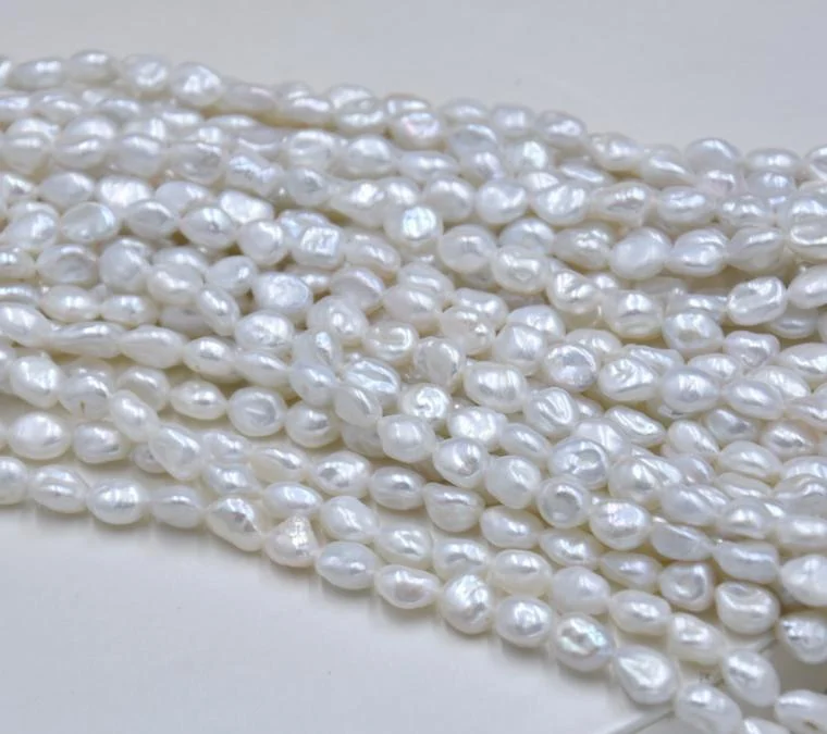 Cream White Lightly Blemished Organic Freshwater Keshi Baroque Pearl Strand