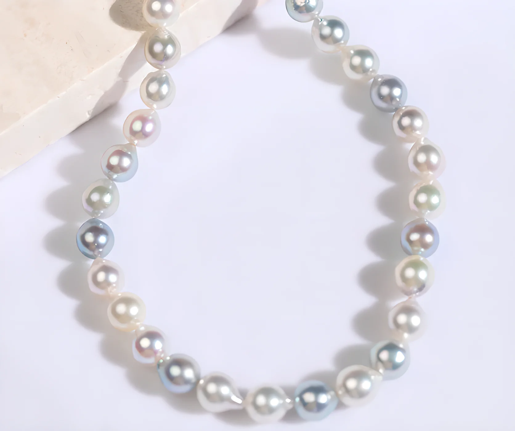 Akoya pearls showing silver-gray and rosé color variations