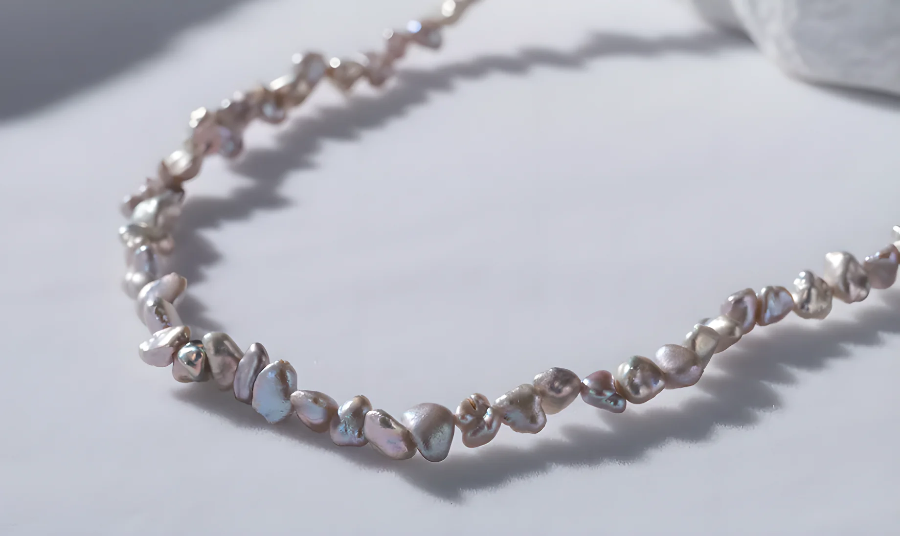 Caption: Keshi pearls can appear in different sizes, body colors, and overtone combinations depending on the oyster species and growing conditions.