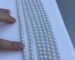 clean close-up photo of white or pastel freshwater pearl strands.