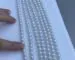 clean close-up photo of white or pastel freshwater pearl strands.